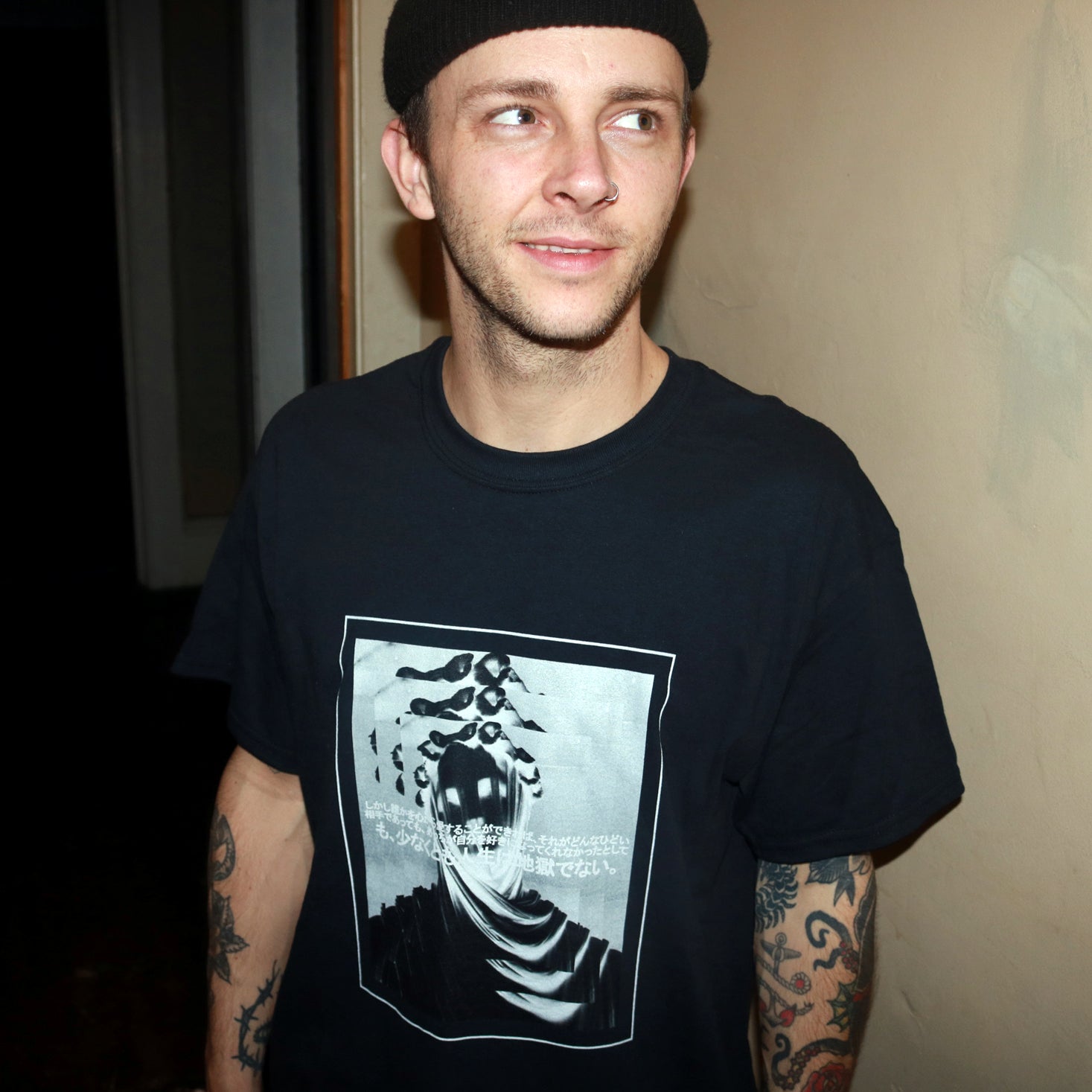 Surreal repeating inverted image of veiled woman statue featuring a japanese quote from Haruki Murakami's 1Q84